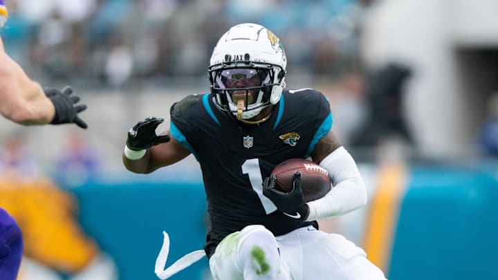 Nov 10, 2024; Jacksonville, Florida, USA; Jacksonville Jaguars running back Travis Etienne Jr (1) runs the ball after the catch agains the Minnesota Vikings in the first quarter at EverBank Stadium. Mandatory Credit: Jeremy Reper-Imagn Images
