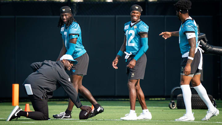 Jacksonville Jaguars wide receiver Brian Thomas Jr. (7) Jacksonville Jaguars wide receiver Travis Hunter (12) and Jacksonville Jaguars wide receiver Dyami Brown (5) have a laugh while running drills during the seventh organized team activity at the Miller Electric Center in Jacksonville, Fla. Monday, June 2, 2025. [Doug Engle/Florida Times-Union]