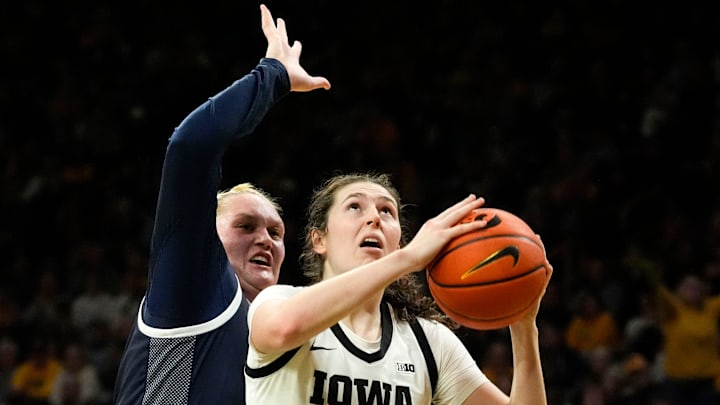Iowa center Ava Heiden (5) looks to shoot the ball as Penn State center Gracie Merkle (44) defends Dec. 28, 2025 at Carver-Hawkeye Arena in Iowa City, Iowa.