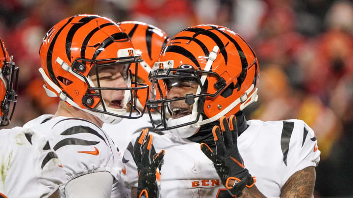 Jan 29, 2023; Kansas City, Missouri, USA; Cincinnati Bengals quarterback Joe Burrow (9) talks with wide receiver Ja'Marr Chase (1) on field against the Kansas City Chiefs during the AFC Championship game at GEHA Field at Arrowhead Stadium. Mandatory Credit: Denny Medley-USA TODAY Sports