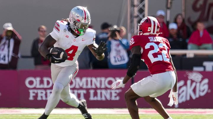 Ohio State Buckeyes wide receiver Jeremiah Smith (4) runs past Indiana Hoosiers defensive back Jamari Sharpe (22) during the NCAA football game at Memorial Stadium Stadium in Bloomington, Ind. on Oct. 17, 2026. Ohio State Buckeyes wide receiver Jeremiah Smith (4) runs past Indiana Hoosiers defensive back Jamari Sharpe (22) during the NCAA football game at Memorial Stadium Stadium in Bloomington, Ind. on Oct. 17, 2026.