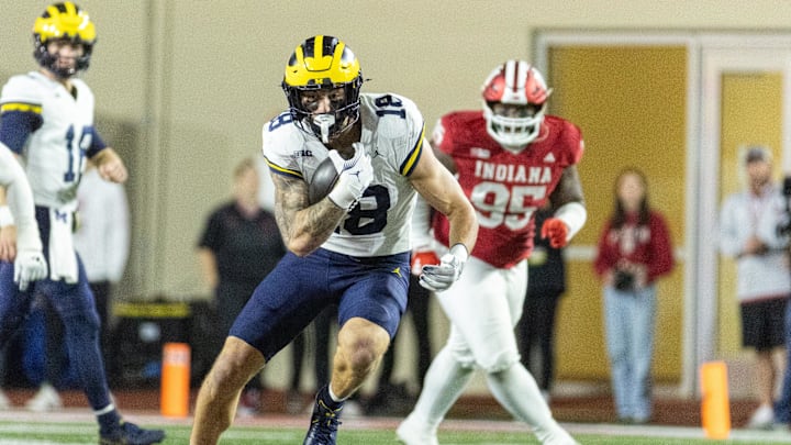 Nov 9, 2024; Bloomington, Indiana, USA; Michigan Wolverines tight end Colston Loveland (18) runs with the ball in the second half against the Indiana Hoosiers at Memorial Stadium. Mandatory Credit: Trevor Ruszkowski-Imagn Images Nov 9, 2024; Bloomington, Indiana, USA; Michigan Wolverines tight end Colston Loveland (18) runs with the ball in the second half against the Indiana Hoosiers at Memorial Stadium. Mandatory Credit: Trevor Ruszkowski-Imagn Images