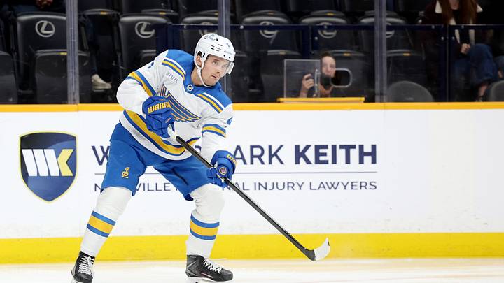 Oct 17, 2026; Nashville, Tennessee, USA;  St. Louis Blues defenseman Theo Lindstein (4) passes the puck during the first period against the Nashville Predators at Bridgestone Arena.  Mandatory Credit: Alan Poizner-Imagn Images