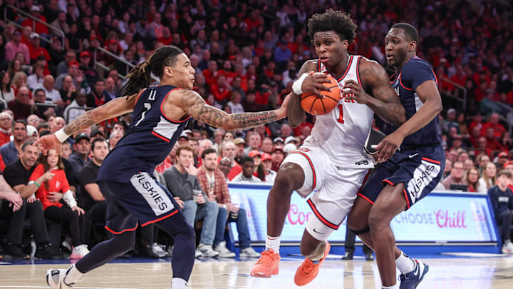 Feb 23, 2025; New York, New York, USA;  St. John's basketball guard Kadary Richmond (1) drives past Connecticut Huskies guard Solo Ball (1) in the second half at Madison Square Garden.