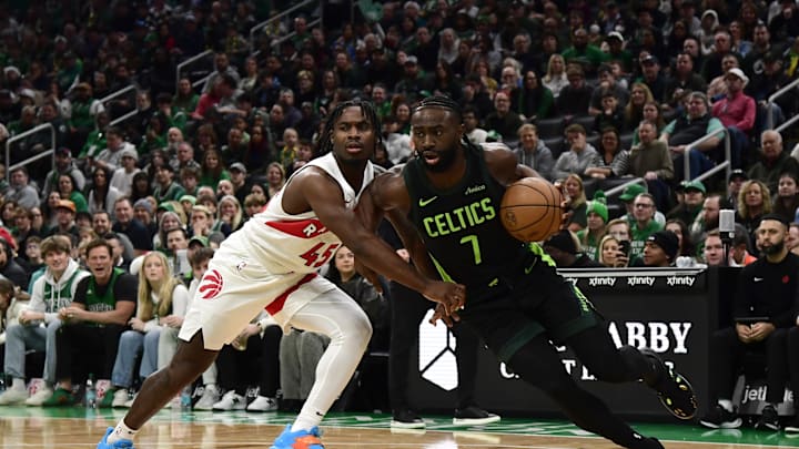 Dec 31, 2024; Boston, Massachusetts, USA; Boston Celtics guard Jaylen Brown (7) drives to the basket while Toronto Raptors guard Davion Mitchell (45) defends during the first half at TD Garden. Mandatory Credit: Bob DeChiara-Imagn Images Dec 31, 2024; Boston, Massachusetts, USA; Boston Celtics guard Jaylen Brown (7) drives to the basket while Toronto Raptors guard Davion Mitchell (45) defends during the first half at TD Garden. Mandatory Credit: Bob DeChiara-Imagn Images