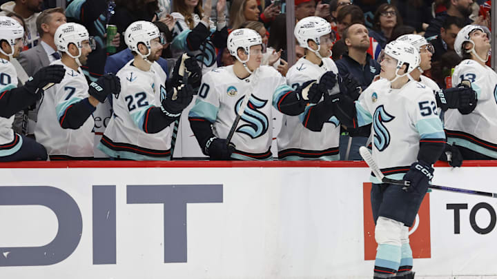Jan 11, 2024; Washington, District of Columbia, USA; Seattle Kraken left wing Tye Kartye (52) celebrates with teammates after scoring a goal against the Washington Capitals in the first period at Capital One Arena. Mandatory Credit: Geoff Burke-Imagn Images