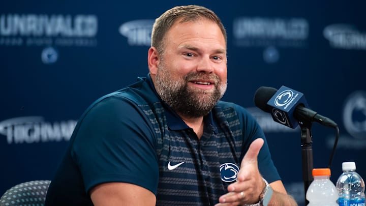 Penn State offensive coordinator Andy Kotelnicki talks with reporters during football media day in Beaver Stadium.