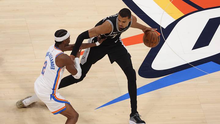May 26, 2026; Oklahoma City, Oklahoma, USA; San Antonio Spurs forward Victor Wembanyama (1) dribbles against Oklahoma City Thunder guard Shai Gilgeous-Alexander (2) during the second quarter in game five of the western conference finals for the 2026 NBA playoffs at Paycom Center. Mandatory Credit: Brett Rojo-Imagn Images