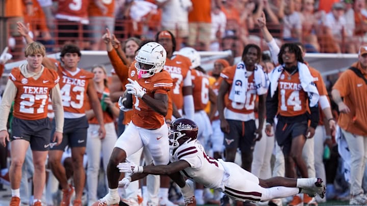 Sep 28, 2024; Austin, Texas, USA;  Mississippi State Bulldogs safety Corey Ellington (10) tackles Texas Longhorns wide receiver Johntay Cook II (1) in the second half at Darrell K Royal-Texas Memorial Stadium. Mandatory Credit: Daniel Dunn-Imagn Images