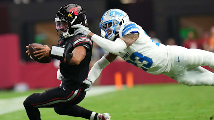 Arizona Cardinals quarterback Kyler Murray (1) is dragged down by Detroit Lions cornerback Carlton Davis (23).