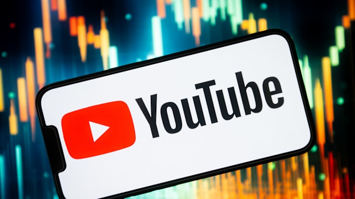 In this photo illustration a YouTube logo seen displayed on...