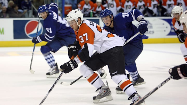 Sep 17, 2009; London, ON, Canada; Philadelphia Flyers center Jonathon Kalinski (37) skates with the puck against the Toronto Maple Leafs at the John Labatt Centre. Mandatory Credit: Tom Szczerbowski-Imagn Images