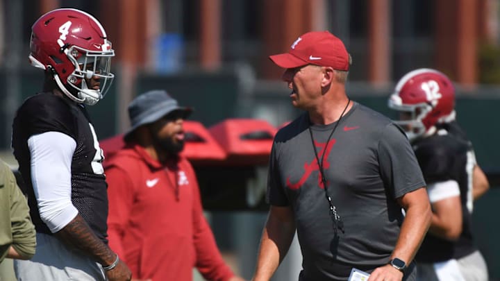 The Alabama Crimson Tide football team works out Sunday morning in practice as they prepare for the 2024 season. Alabama quarterback Jalen Milroe (4) listens to directions from Alabama head coach Kalen DeBoer.
