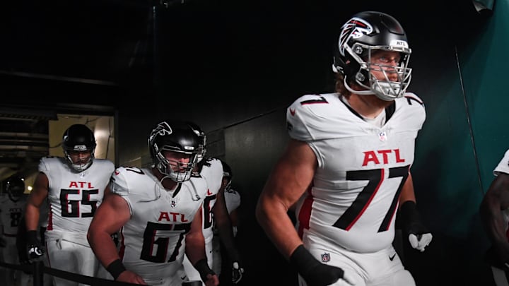 Sep 16, 2024; Philadelphia, Pennsylvania, USA; Atlanta Falcons guard Matthew Bergeron (65), center Drew Dalman (67) and offensive tackle Storm Norton (77) run onto the field against the Philadelphia Eagles at Lincoln Financial Field. Mandatory Credit: Eric Hartline-Imagn Images