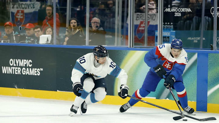 Feb 11, 2026; Milan, Italy; Dalibor Dvorsky of Slovakia in action with Henri Jokiharju of Finland in men's ice hockey group B play during the Milano Cortina 2026 Olympic Winter Games at Milano Santagiulia Ice Hockey Arena. Mandatory Credit: Geoff Burke-Imagn Images Feb 11, 2026; Milan, Italy; Dalibor Dvorsky of Slovakia in action with Henri Jokiharju of Finland in men's ice hockey group B play during the Milano Cortina 2026 Olympic Winter Games at Milano Santagiulia Ice Hockey Arena. Mandatory Credit: Geoff Burke-Imagn Images