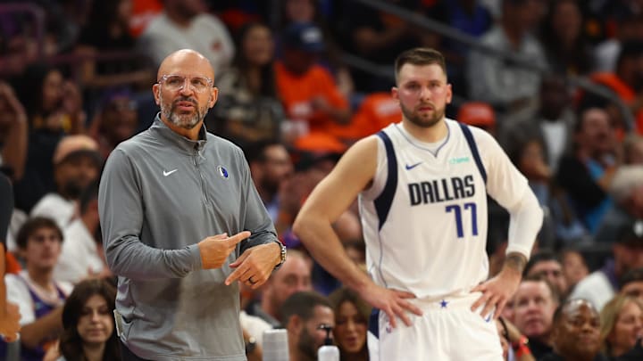 Oct 26, 2024; Phoenix, Arizona, USA; Dallas Mavericks head coach Jason Kidd with guard Luka Doncic (77) against the Phoenix Suns in the first half at Footprint Center. Mandatory Credit: Mark J. Rebilas-Imagn Images