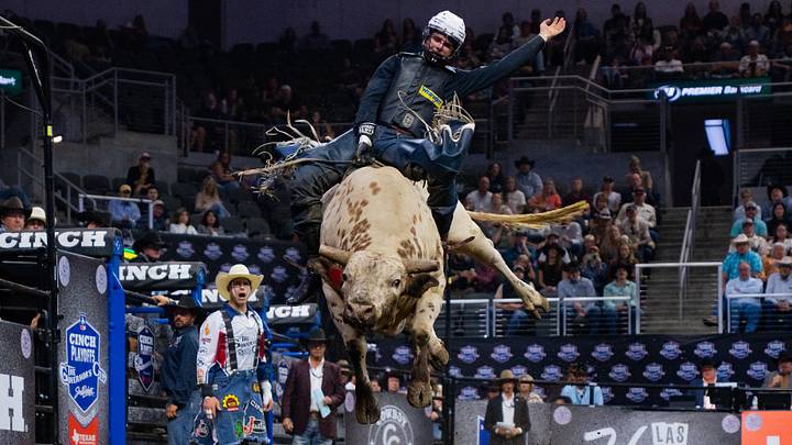 A bull rider A bull rider