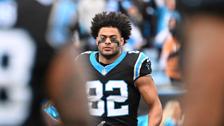 Carolina Panthers tight end Tommy Tremble (82) runs on to the field before the game 