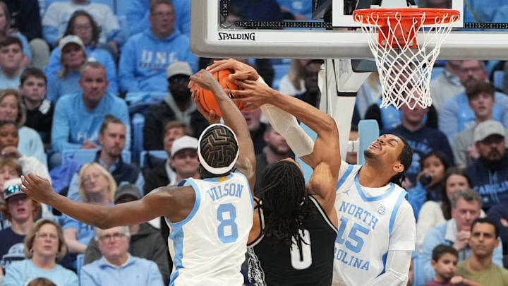 Dec 7, 2025; Chapel Hill, North Carolina, USA; North Carolina Tar Heels forward Caleb Wilson (8) and forward Jarin Stevenson (15) block the shot of Georgetown Hoyas forward Jayden Fort (0) in the second half at Dean E. Smith Center. Mandatory Credit: Bob Donnan-Imagn Images Dec 7, 2025; Chapel Hill, North Carolina, USA; North Carolina Tar Heels forward Caleb Wilson (8) and forward Jarin Stevenson (15) block the shot of Georgetown Hoyas forward Jayden Fort (0) in the second half at Dean E. Smith Center. Mandatory Credit: Bob Donnan-Imagn Images