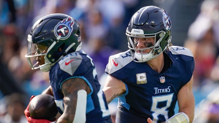 Tennessee Titans quarterback Will Levis (8) hands off to running back Tony Pollard (20) during the first quarter against the Minnesota Vikings at Nissan Stadium in Nashville, Tenn., Sunday, Nov. 17, 2024.