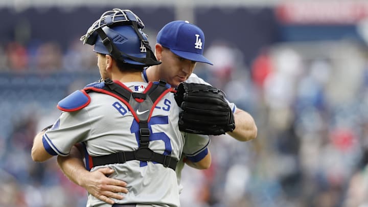 Los Angeles Dodgers relief pitcher Evan Phillips (59) celebrates with Dodgers catcher Austin Barnes (15) after the final out against the Washington Nationals at Nationals Park on April 25, 2024.