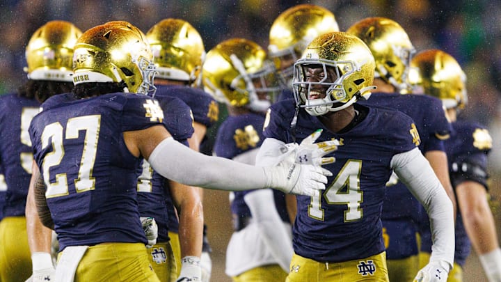 Notre Dame cornerback Dallas Golden (14) and linebacker Kyngstonn Viliamu-Asa (27) celebrate after getting a stop on fourth down in the second half of a NCAA football game against Southern California at Notre Dame Stadium on Saturday, Oct. 18, 2025, in South Bend. Notre Dame cornerback Dallas Golden (14) and linebacker Kyngstonn Viliamu-Asa (27) celebrate after getting a stop on fourth down in the second half of a NCAA football game against Southern California at Notre Dame Stadium on Saturday, Oct. 18, 2025, in South Bend.