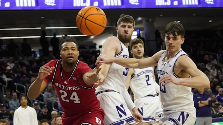 Jan 29, 2025; Evanston, Illinois, USA; Rutgers Scarlet Knights center Lathan Sommerville (24) and Northwestern Wildcats guard Brooks Barnhizer (13) go for the ball during the first half at Welsh-Ryan Arena. Mandatory Credit: David Banks-Imagn Images