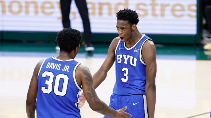 BYU Cougars forward AJ Dybantsa (3) reacts with guard Kennard Davis Jr. (30) BYU Cougars forward AJ Dybantsa (3) reacts with guard Kennard Davis Jr. (30)