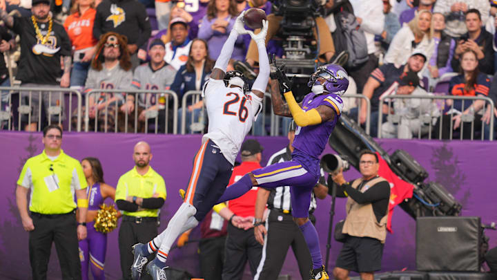 Nov 16, 2025; Minneapolis, Minnesota, USA;  Chicago Bears cornerback Nahshon Wright (26) intercepts a pass intended for Minnesota Vikings wide receiver Jordan Addison (3) during the second quarter at U.S. Bank Stadium. Mandatory Credit: Brad Rempel-Imagn Images