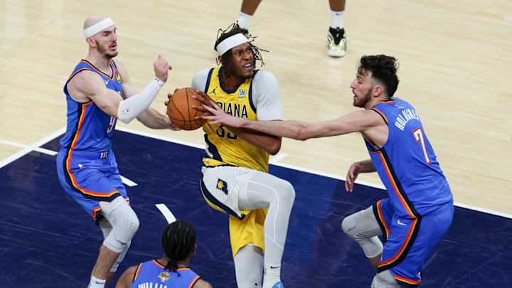 Jun 19, 2025; Indianapolis, Indiana, USA; Indiana Pacers center Myles Turner (33) drives to the basket against Oklahoma City Thunder guard Alex Caruso (9) and forward Chet Holmgren (7) in the second quarter during game six of the 2025 NBA Finals at Gainbridge Fieldhouse. Mandatory Credit: Trevor Ruszkowski-Imagn Images Jun 19, 2025; Indianapolis, Indiana, USA; Indiana Pacers center Myles Turner (33) drives to the basket against Oklahoma City Thunder guard Alex Caruso (9) and forward Chet Holmgren (7) in the second quarter during game six of the 2025 NBA Finals at Gainbridge Fieldhouse. Mandatory Credit: Trevor Ruszkowski-Imagn Images