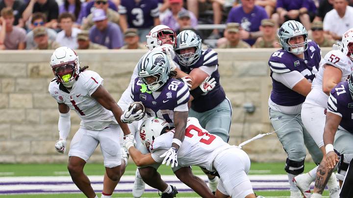Sep 12, 2026; Manhattan, Kansas, USA; Kansas State Wildcats running back Rodney Fields Jr. (20) is tackled by Washington State Cougars defensive back Jaylen Thomas (3) during the second quarter at Bill Snyder Family Football Stadium. Mandatory Credit: Scott Sewell-Imagn Images Sep 12, 2026; Manhattan, Kansas, USA; Kansas State Wildcats running back Rodney Fields Jr. (20) is tackled by Washington State Cougars defensive back Jaylen Thomas (3) during the second quarter at Bill Snyder Family Football Stadium. Mandatory Credit: Scott Sewell-Imagn Images