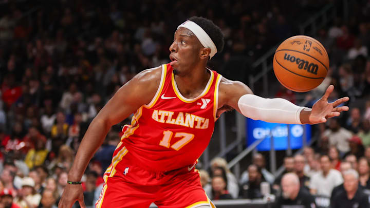 Feb 5, 2025; Atlanta, Georgia, USA; Atlanta Hawks forward Onyeka Okongwu (17) reaches for a loose ball against the San Antonio Spurs in the third quarter at State Farm Arena. Mandatory Credit: Brett Davis-Imagn Images
