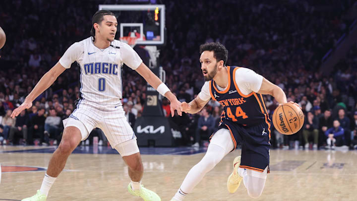 Jan 6, 2025; New York, New York, USA;  New York Knicks guard Landry Shamet (44) looks to drive past Orlando Magic guard Anthony Black (0) in the first quarter at Madison Square Garden. Mandatory Credit: Wendell Cruz-Imagn Images
