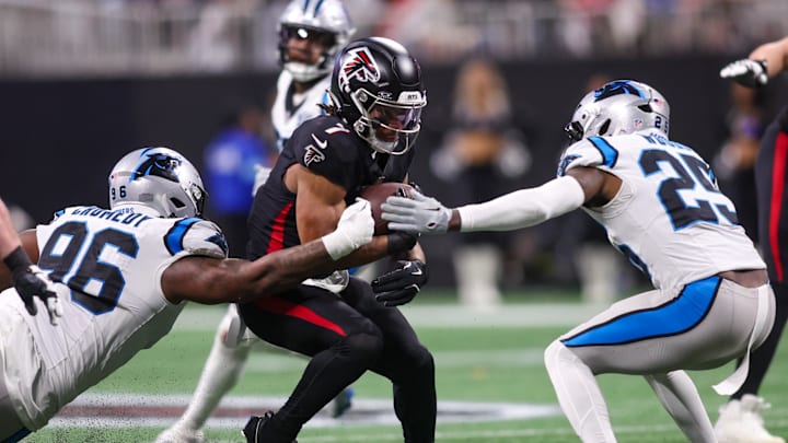 Jan 5, 2025; Atlanta, Georgia, USA; Atlanta Falcons running back Bijan Robinson (7) runs the ball against the Carolina Panthers in the fourth quarter at Mercedes-Benz Stadium. Mandatory Credit: Brett Davis-Imagn Images