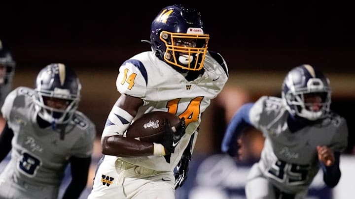 Webb’s Joel Wyatt (14) runs the ball against Pope John Paul II during the second half at Pope Saint John Paul II Preparatory School in Hendersonville, Tenn., Friday, Sept. 13, 2024.