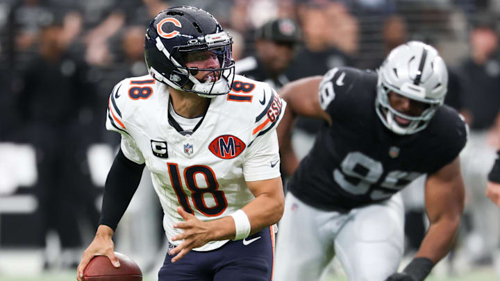 Bears quarterback Caleb Williams (18) rolls out against the Raiders in Week 4. Bears quarterback Caleb Williams (18) rolls out against the Raiders in Week 4.
