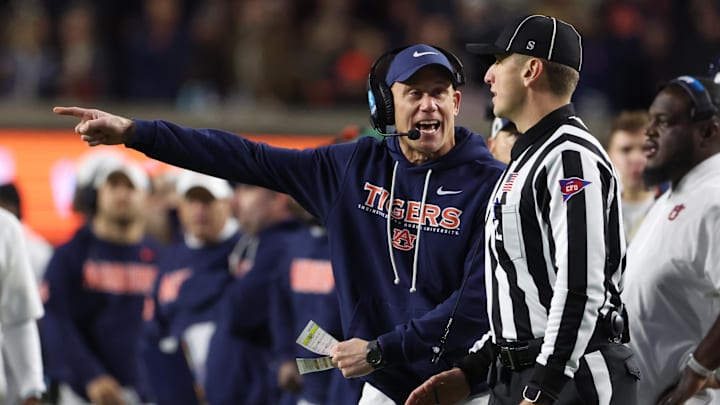 Nov 29, 2025; Auburn, Alabama, USA; Auburn Tigers interim head coach DJ Durkin talks to a referee during the second half against the Alabama Crimson Tide at Jordan-Hare Stadium. Mandatory Credit: John Reed-Imagn Images Nov 29, 2025; Auburn, Alabama, USA; Auburn Tigers interim head coach DJ Durkin talks to a referee during the second half against the Alabama Crimson Tide at Jordan-Hare Stadium. Mandatory Credit: John Reed-Imagn Images
