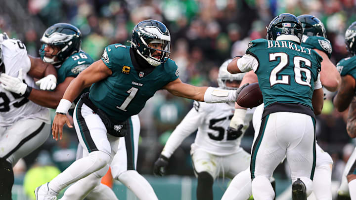 Dec 14, 2025; Philadelphia, Pennsylvania, USA; Philadelphia Eagles quarterback Jalen Hurts (1) hands off to running back Saquon Barkley (26) during the third quarter against the Las Vegas Raiders at Lincoln Financial Field. Dec 14, 2025; Philadelphia, Pennsylvania, USA; Philadelphia Eagles quarterback Jalen Hurts (1) hands off to running back Saquon Barkley (26) during the third quarter against the Las Vegas Raiders at Lincoln Financial Field.