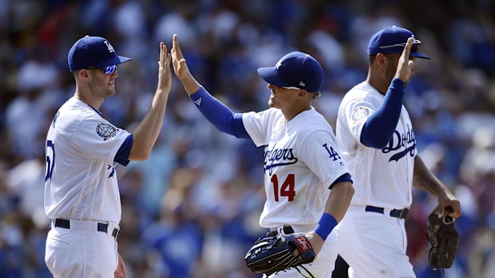 Jul 15, 2018; Los Angeles, CA, USA; Los Angeles Dodgers second baseman Enrique Hernandez (14) celebrates with pitcher Alex Wood (57) after the game against the Los Angeles Angels at Dodger Stadium. Mandatory Credit: Kelvin Kuo-Imagn Images Jul 15, 2018; Los Angeles, CA, USA; Los Angeles Dodgers second baseman Enrique Hernandez (14) celebrates with pitcher Alex Wood (57) after the game against the Los Angeles Angels at Dodger Stadium. Mandatory Credit: Kelvin Kuo-Imagn Images