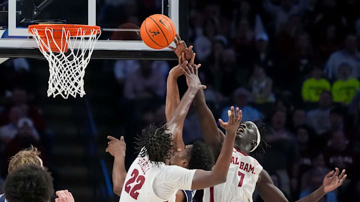 Alabama forward Aiden Sherrell (22) and Alabama forward Taylor Bol Bowen (7) block a shot by Arizona forward Tobe Awaka . Alabama forward Aiden Sherrell (22) and Alabama forward Taylor Bol Bowen (7) block a shot by Arizona forward Tobe Awaka .