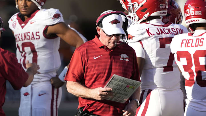 Nov 22, 2025; Austin, Texas, USA; Arkansas Razorbacks interim head coach Bobby Petrino looks at his notes during the first half against the Texas Longhorns at Darrell K Royal-Texas Memorial Stadium. Mandatory Credit: Scott Wachter-Imagn Images Nov 22, 2025; Austin, Texas, USA; Arkansas Razorbacks interim head coach Bobby Petrino looks at his notes during the first half against the Texas Longhorns at Darrell K Royal-Texas Memorial Stadium. Mandatory Credit: Scott Wachter-Imagn Images