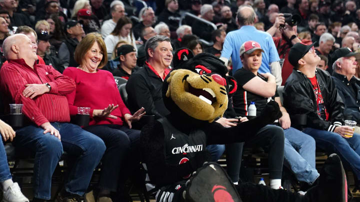 The Cincinnati Bearcats mascot entertains fans during a timeout in the first half of an NCAA college basketball game between the Houston Cougars and the Cincinnati Bearcats, Saturday, Feb. 10, 2024, at Fifth Third Arena in Cincinnati. The Cincinnati Bearcats mascot entertains fans during a timeout in the first half of an NCAA college basketball game between the Houston Cougars and the Cincinnati Bearcats, Saturday, Feb. 10, 2024, at Fifth Third Arena in Cincinnati.