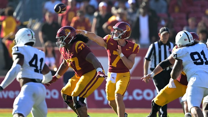 Oct 12, 2024; Los Angeles, California, USA;  USC Trojans quarterback Miller Moss (7) throws a pass in the second half against the Penn State Nittany Lions at United Airlines Field at Los Angeles Memorial Coliseum. Mandatory Credit: Jayne Kamin-Oncea-Imagn Images