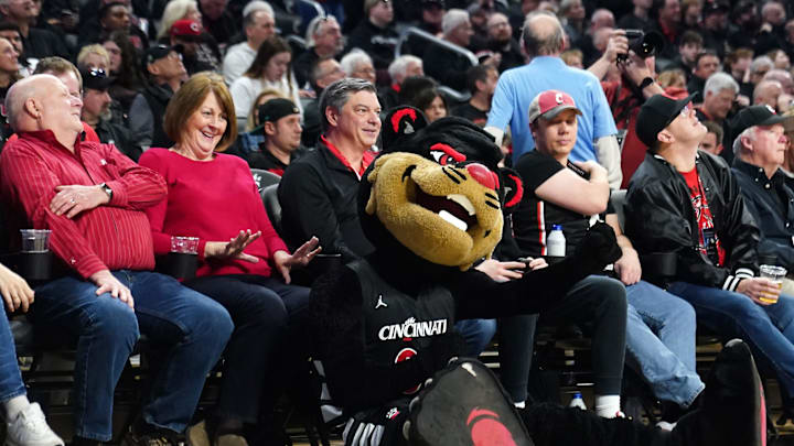 The Cincinnati Bearcats mascot entertains fans during a timeout in the first half of an NCAA college
