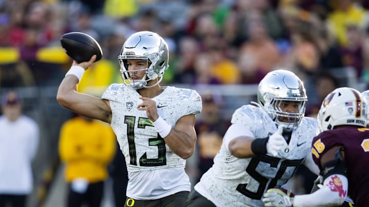 Nov 18, 2023; Tempe, Arizona, USA; Oregon Ducks quarterback Ty Thompson (13) against the Arizona State Sun Devils at Mountain America Stadium. Mandatory Credit: Mark J. Rebilas-Imagn Images Nov 18, 2023; Tempe, Arizona, USA; Oregon Ducks quarterback Ty Thompson (13) against the Arizona State Sun Devils at Mountain America Stadium. Mandatory Credit: Mark J. Rebilas-Imagn Images