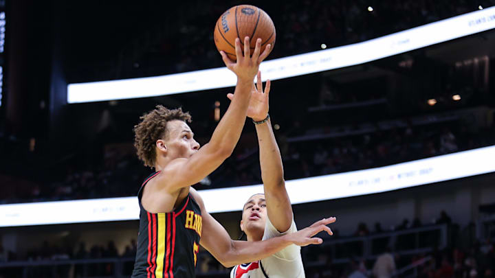 Nov 15, 2024; Atlanta, Georgia, USA; Atlanta Hawks guard Dyson Daniels (5) shoots the ball against Washington Wizards forward Kyshawn George (18) during the third quarter at State Farm Arena. Mandatory Credit: Jordan Godfree-Imagn Images Nov 15, 2024; Atlanta, Georgia, USA; Atlanta Hawks guard Dyson Daniels (5) shoots the ball against Washington Wizards forward Kyshawn George (18) during the third quarter at State Farm Arena. Mandatory Credit: Jordan Godfree-Imagn Images