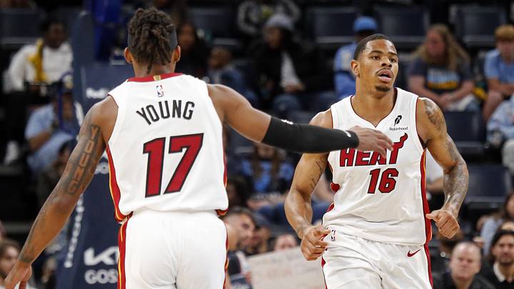 Oct 24, 2025; Memphis, Tennessee, USA; Miami Heat forward Keshad Johnson (16) reacts with guard Jahmir Young (17) during the fourth quarter against the Memphis Grizzlies at FedExForum. Mandatory Credit: Petre Thomas-Imagn Images