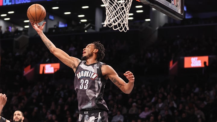 Dec 21, 2024; Brooklyn, New York, USA;  Brooklyn Nets center Nic Claxton (33) grabs a rebound against the Utah Jazz in the third quarter at Barclays Center. Mandatory Credit: Wendell Cruz-Imagn Images