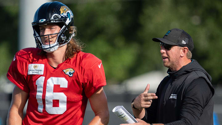 Jacksonville Jaguars quarterback Trevor Lawrence (16) gets coached by Jaguars Head Coach Liam Coen during the Jaguars 14th NFL training camp session at Miller Electric Center Tuesday August 12, 2025 in Jacksonville, Fla. The Jaguars travel to New Orleans to play the Saints this Sunday in their second preseason game. [Doug Engle/Florida Times-Union]