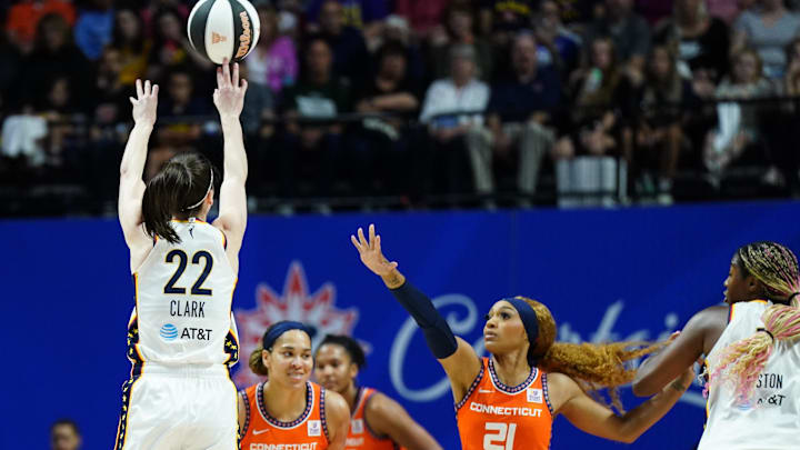 Jun 10, 2024; Uncasville, Connecticut, USA; Indiana Fever guard Caitlin Clark (22) shoots for three points against Connecticut Sun guard DiJonai Carrington (21) in the second quarter at Mohegan Sun Arena. Mandatory Credit: David Butler II-Imagn Images Jun 10, 2024; Uncasville, Connecticut, USA; Indiana Fever guard Caitlin Clark (22) shoots for three points against Connecticut Sun guard DiJonai Carrington (21) in the second quarter at Mohegan Sun Arena. Mandatory Credit: David Butler II-Imagn Images